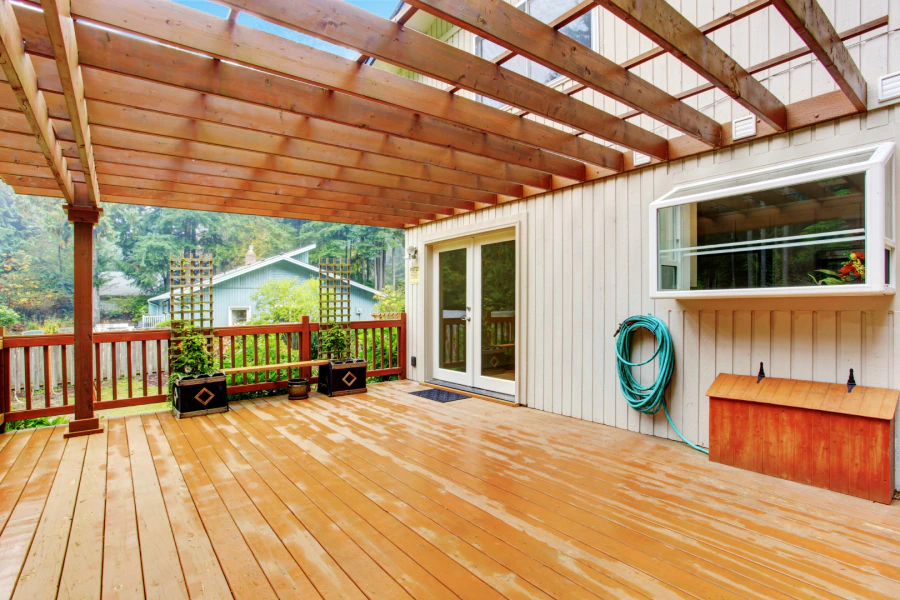 walkout wooden deck with attached pergola